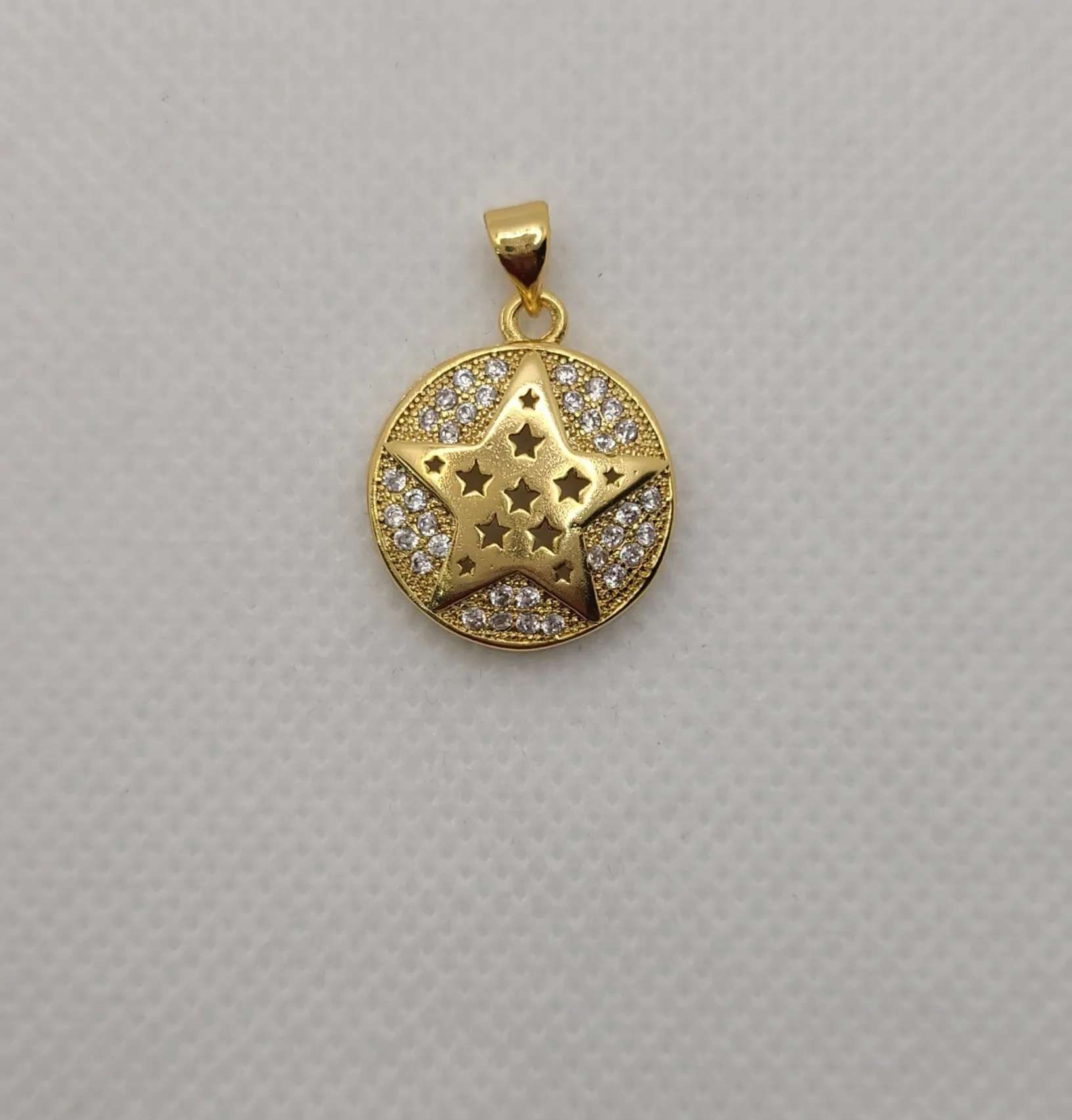 Gold plated star-shaped & star design pendant.